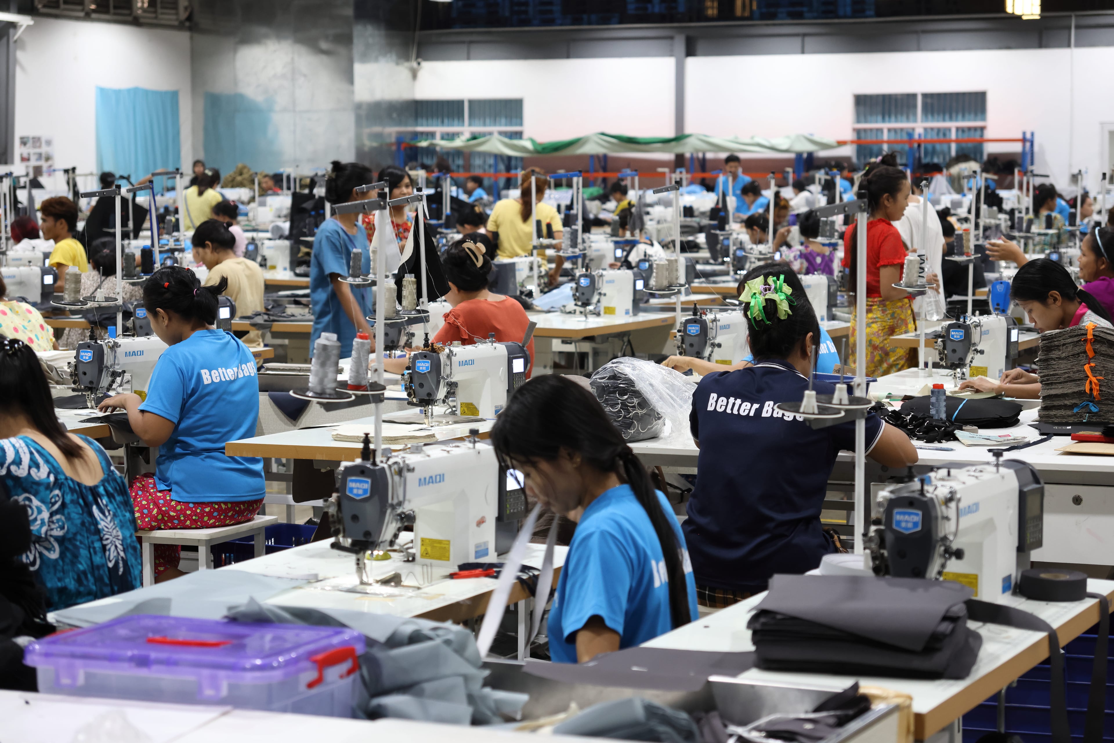 The Better Bags Myanmar sewing line, with around 420 MAQI sewing machines in rows.